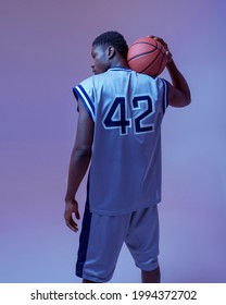 Basketball Player Poses With Ball, Back View