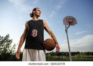 Basketball player practicing and posing for basketball and sports athlete concept - Powered by Shutterstock