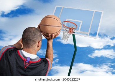 Basketball Player Throws Ball Into Basket Stock Photo 2045622287