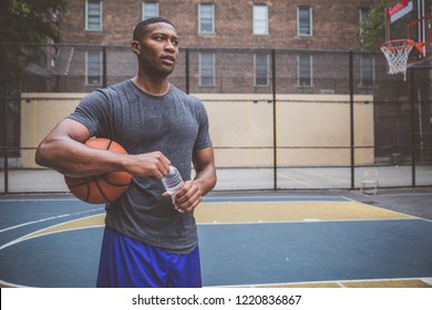 Basketball player training on a court in New york city - Powered by Shutterstock