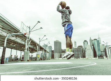 Basketball player training on New york pier 1 courts. concept about sport and people - Powered by Shutterstock