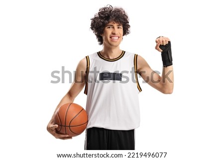 Basketball player wearing a wrist splint brace and smiling isolated on white background
