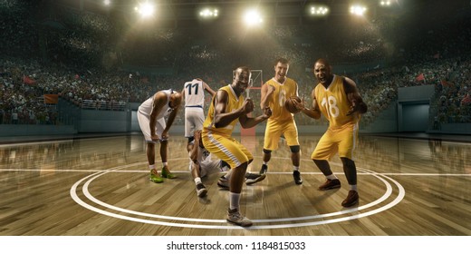 Basketball Players Emotionally Rejoice At Victory On Professional Basketball Stadium. Players From Opposing Teams Are Sad Because Of The Defeat