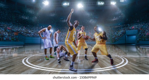 Basketball Players Emotionally Rejoice At Victory On Professional Basketball Stadium. Players From Opposing Teams Are Sad Because Of The Defeat