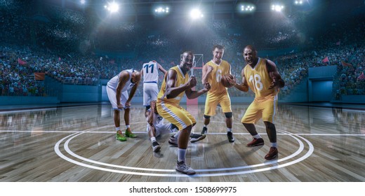 Basketball Players Emotionally Rejoice At Victory On Professional Basketball Stadium. Players From Opposing Teams Are Sad Because Of The Defeat