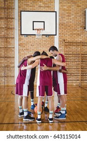 Basketball Players Forming A Huddle In The Court 