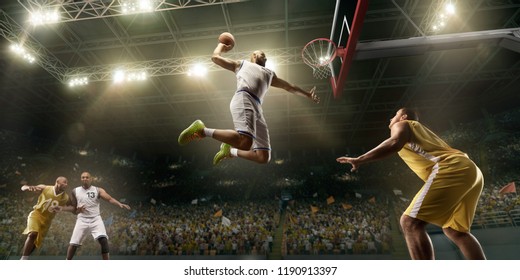 Basketball Players On Big Professional Arena During The Game. Basketball Player Makes Slum Dunk. Bottom View