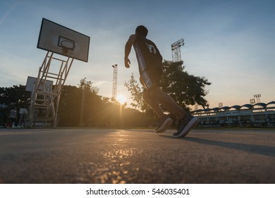 Basketball Players Playing Basketball Outdoor.