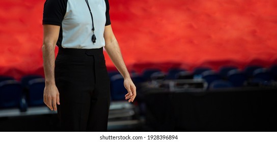 Basketball Referee With Whistle On Red Background
