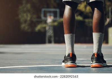 Basketball, sneakers and athlete black man standing on community sports court for match, motivation and streetball memory. Male player outside in USA with sport shoes on feet for fitness and exercise - Powered by Shutterstock