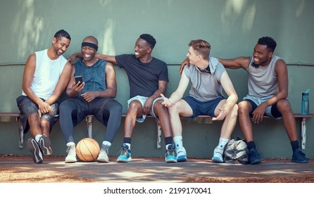 Basketball, Sport And Friends With A Team Of Men Sitting On A Bench After Training, Practice Or A Game. Teamwork, Phone And Exercise With A Group Of Basket Ball Players Outside On A Sports Court