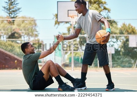 Basketball, sports and teamwork, helping hand and support, respect and assistance in competition training games. Happy basketball player holding hands with friend, trust and kindness on outdoor court