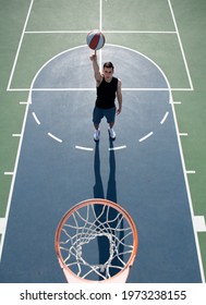 Basketball Street Player With Basketball Ball Outdoor. Hand Spinning Basket Ball. Balancing Basketball On Finger.