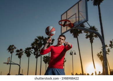 Basketball Street Player With Basketball Ball Outdoor. Hand Spinning Basket Ball. Balancing Basketball On Finger.