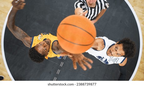 Basketball Tournament Final: Diverse Yellow and White Teams Compete at Center Court for Jump Ball that Starts the Game. Athletic Sportsmen Reach for the Ball. Top Down Cinematic Shot. - Powered by Shutterstock