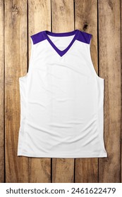 Basketball uniform on wooden background top view
