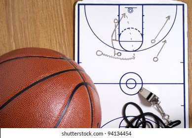 A basketball with a whistle and clipboard with an alley-oop play drawn - Powered by Shutterstock