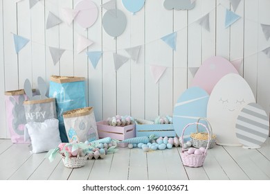 Baskets With Lot Colorful Easter Eggs And Carrots! Spring Home Decoration And Easter Decor. Holiday Flags On Wooden White Wall. Children's Room In The Easter Style. Colorful Easter Room Interior. 