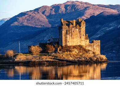 Basking in the glorious glow of the setting sun, Eilean Donan Castle is a breathtaking sight to behold just before nightfall. 🌅✨ #Scotland - Powered by Shutterstock