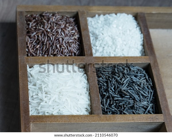 basmati rice black and red wooden box with\
sections close-up