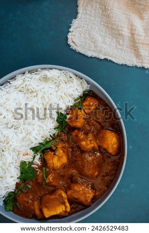 Basmati rice with curry chicken, cilantro and parsley
