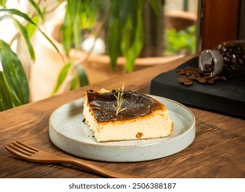 Basque cheesecake slice with fork served in dish isolated on table side view of taiwan baked cafe dessert food