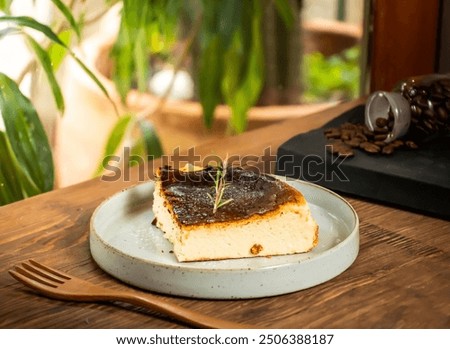 Basque cheesecake slice with fork served in dish isolated on table side view of taiwan baked cafe dessert food