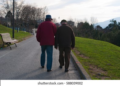 Basque Country, Spain, 25/01/2017: Two Old Men Walking In The Etxebarria Park In Bilbao