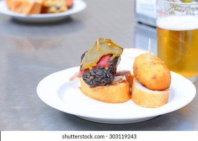 Basque Tapas Or Pintxos With Beer In San Sebastian, Selective Focus