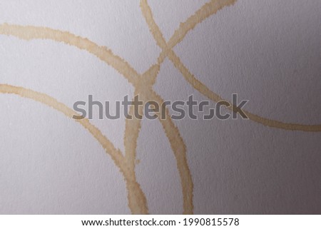 basra, Iraq - june 08, 2021: photo of spill coffee cirlcles by paper cup