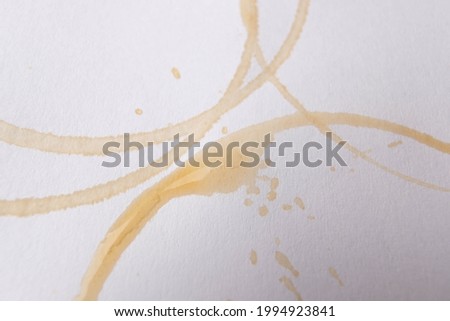 basra, Iraq - june 08, 2021: photo of spill coffee cirlcles by paper cup
