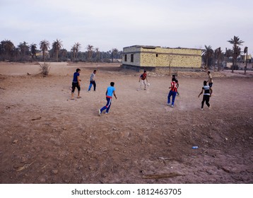 Basra/iraq - 04/19/2014: Several Boys Play Football