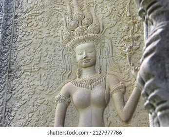 A bas-relief of APSARA showing her teeth with a smile in Angkor Wat. Siem Reap Cambodia