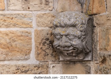 Bas-relief On The Corner Of The House. A Very Sly Look On A Stone Head.