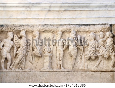 Bas-relief on stone wall of temple in Pergamon, Turkey. UNESCO world heritage site