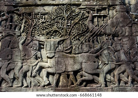 Bas-relief Sculpture at Bayon temple in Angkor Thom, Siem Reap, Cambodia.
