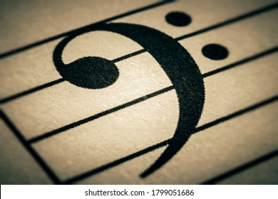 Bass clef or key sign on a musical chart or partition or part macro close-up.