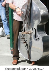 Bass Fiddle Player In Steet Band,  At The U District Street Fair In Seattle