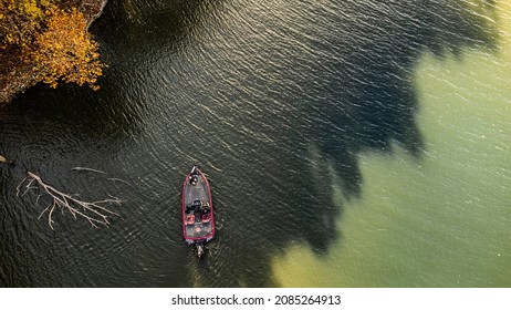 Bass fisherman fishing out of bass boat on fall afternoon. Drone photo taken from above at grand lake oklahoma