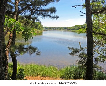 Bass River Estuary With Reflections In The Water Separates The Towns Of Yarmouth And Dennis On The Bass River In Cape Cod,Massachusetts. Near The Cape Cod Rail Trail Bicycle Bridge.