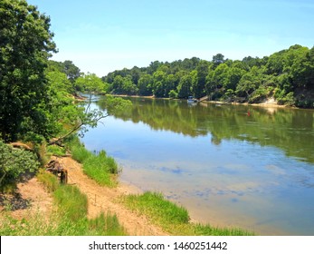 Bass River Estuary,reflections.  Separates The Towns Of Yarmouth And Dennis. Bass River In Cape Cod,Ma. By The Cape Cod Rail Trail Bicycle Bridge.