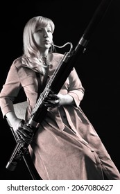 Bassoon Player. Classical Musician Portrait Woman With Wind Instrument