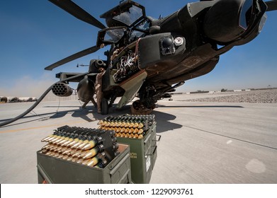 Bastion,Helmend /Afghanistan -Circa 2010
Army Air Corp Ground Crew Re-arm A AH 64 Longbow Apache Attack Helicopter  British Army Air Corp  During Operation Herrick 