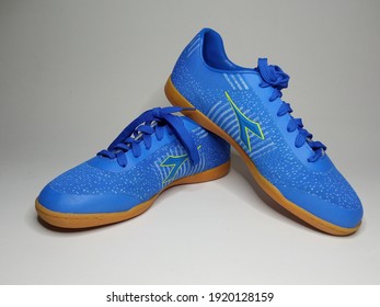 Batam, 19 February 2021: a pair of light blue Diadora "Rafly" shoes isolated on white background