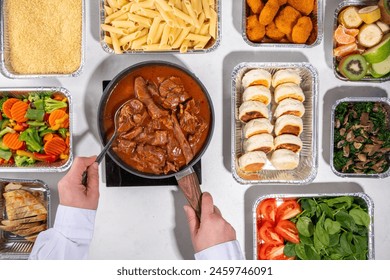 Batch Cooking Meal Prep concept. Several types of side dishes: cereals, pasta, pasta, cooked and fresh vegetables, meat, chicken, nuggets, breakfast pancakes and fruit in food containers  - Powered by Shutterstock