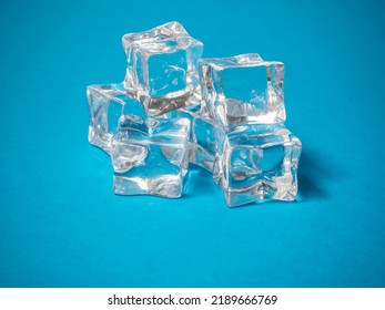 A Batch Of Ice Cubes On A Blue Background. Summer Concept.