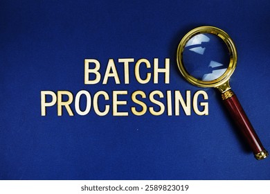 Batch Processing alphabet letters with magnifying glass on navy blue background
