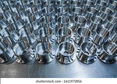 A Batch Of Shiny Metal Cnc Aerospace Parts Production - Close-up With Selective Focus For Industrial Background