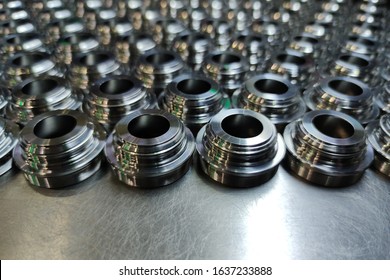 A Batch Of Shiny Metal Cnc Aerospace Parts Production - Close-up With Selective Focus For Industrial Background