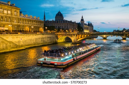 Bateau Mouche Cruising On Seine River At Sunset, Paris.
